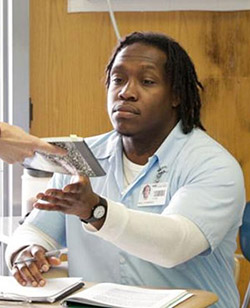 APEP student Torrence Neal, a younger man with dreadlocks